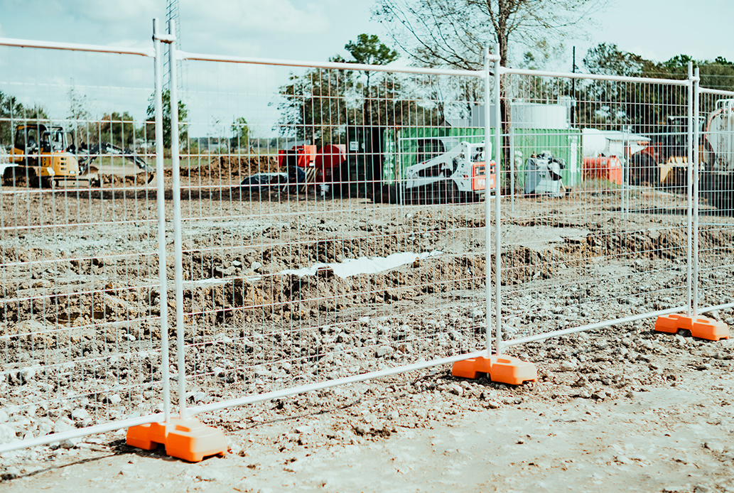 Temporary fencing with footers